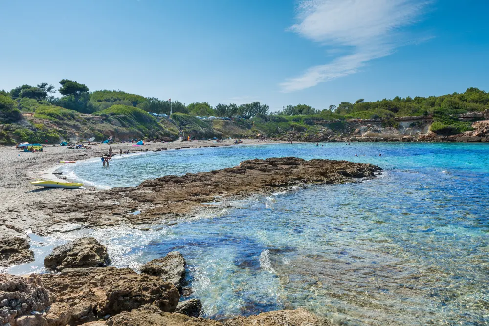 Rocky shoreline and clear water near Alcúdia